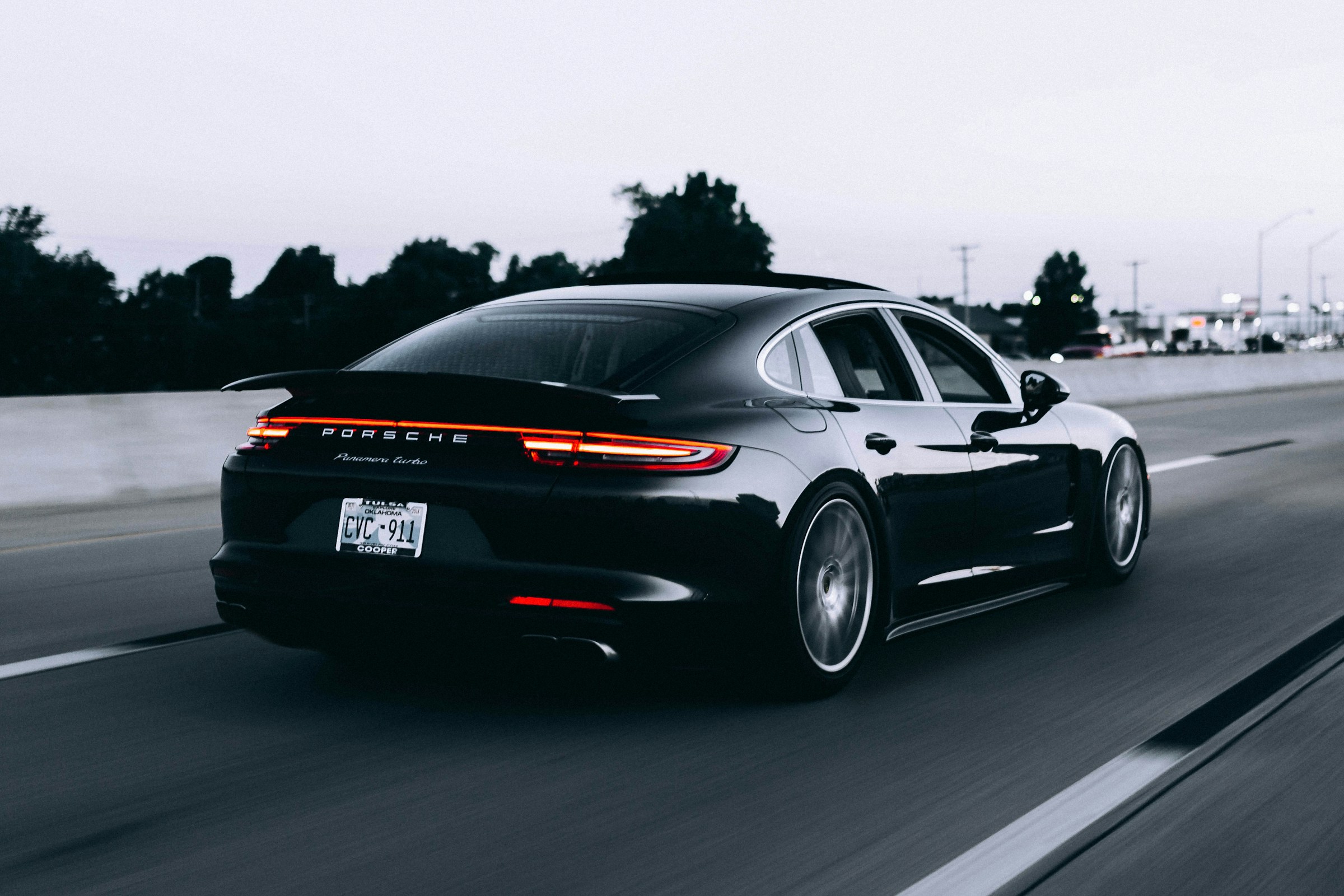 Black Porsche on an open road